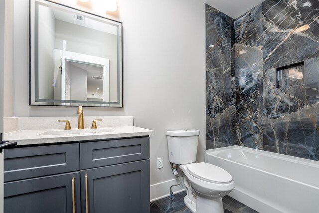 full bathroom featuring tile patterned flooring, toilet, vanity, and tiled shower / bath