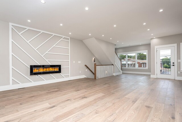 unfurnished living room with light hardwood / wood-style floors