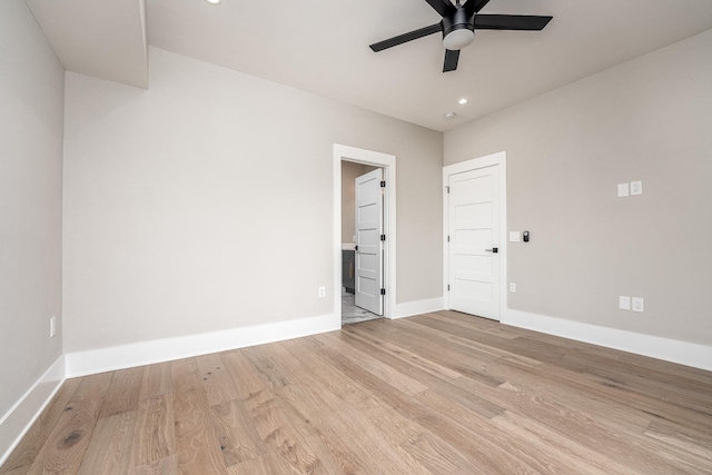 spare room with ceiling fan, recessed lighting, light wood-style flooring, and baseboards