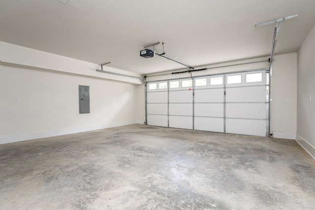 garage with electric panel and a garage door opener