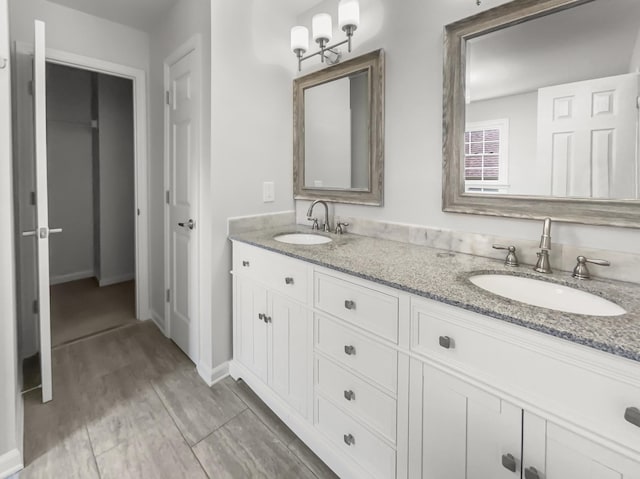 bathroom featuring vanity and hardwood / wood-style flooring