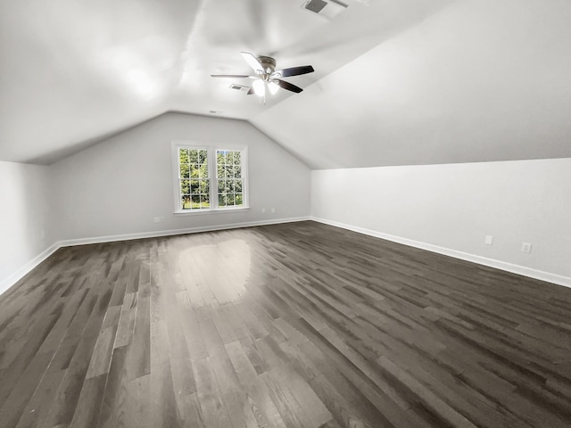 bonus room featuring vaulted ceiling, dark wood-type flooring, and ceiling fan