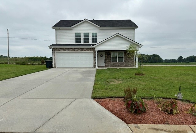 front facade featuring a front yard and a garage