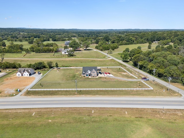 birds eye view of property with a rural view