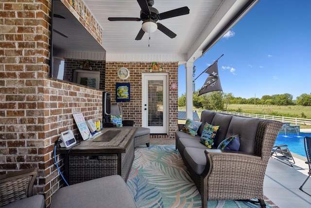 view of patio / terrace with a ceiling fan, a fenced in pool, outdoor lounge area, and fence