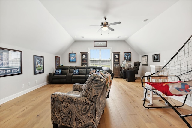 living area featuring lofted ceiling, light wood finished floors, a ceiling fan, and baseboards