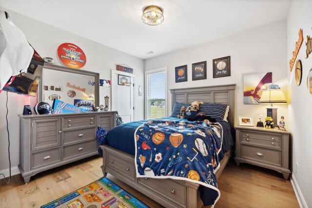 bedroom with light wood-type flooring