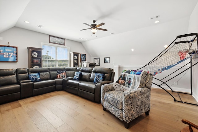 living area featuring light wood finished floors, visible vents, vaulted ceiling, and recessed lighting