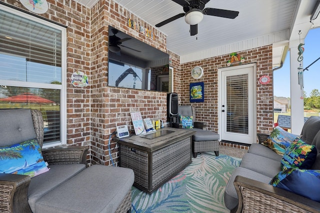 view of patio featuring ceiling fan and an outdoor living space