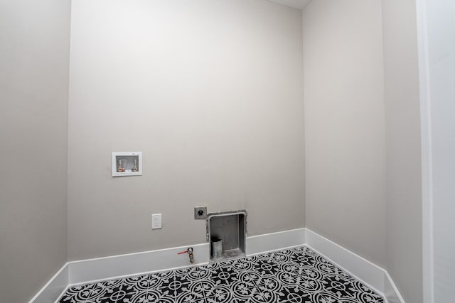 clothes washing area featuring laundry area, baseboards, washer hookup, and electric dryer hookup