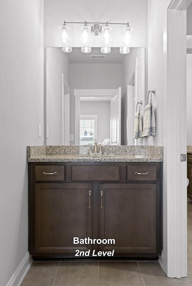 bathroom with vanity and tile patterned floors