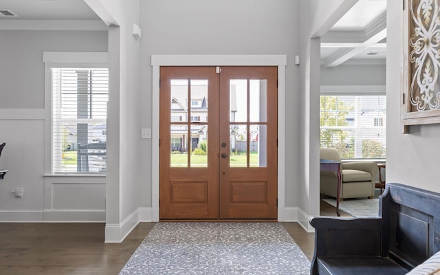 entrance foyer with coffered ceiling, french doors, and plenty of natural light