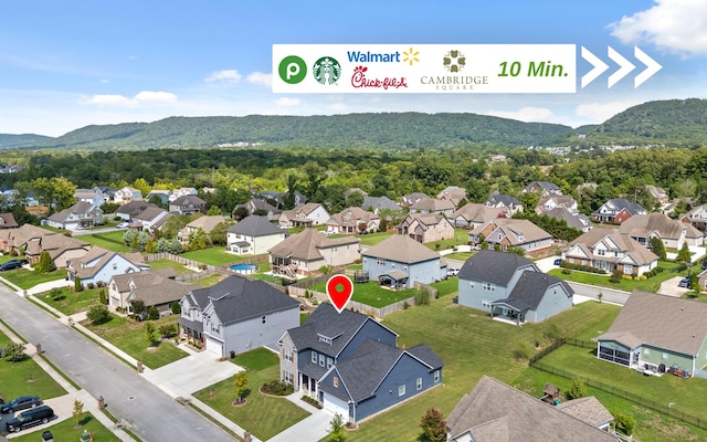 birds eye view of property featuring a mountain view