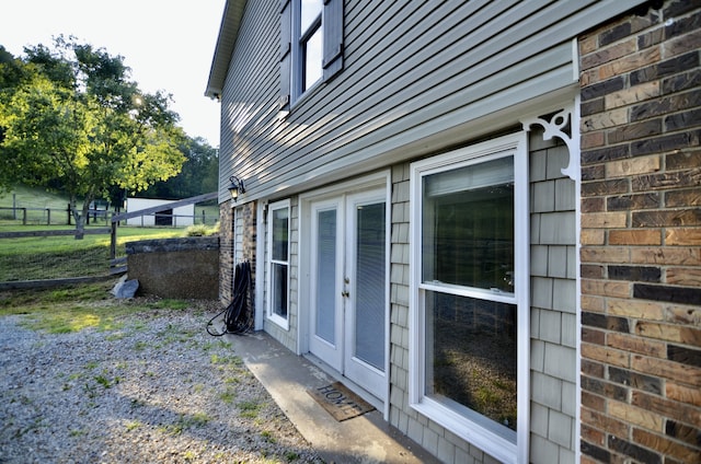 view of property exterior featuring french doors