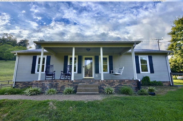 bungalow with a porch and a front yard