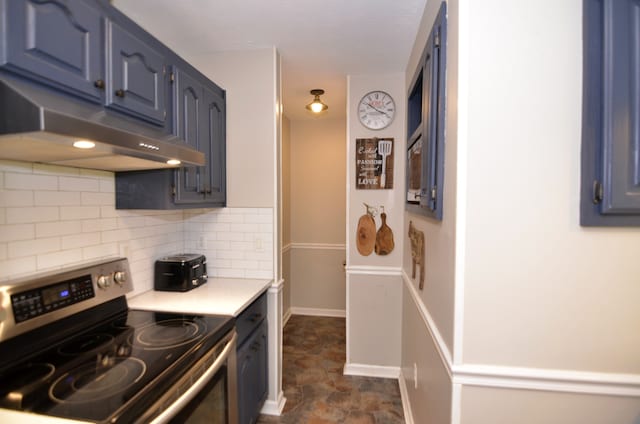 kitchen with backsplash, stainless steel range with electric cooktop, and dark tile patterned flooring