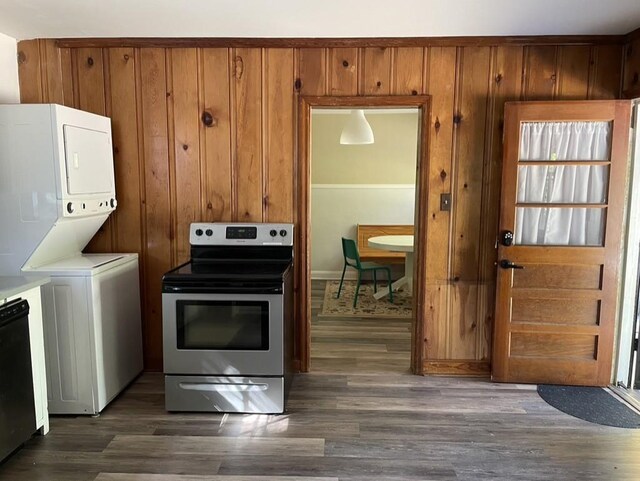 kitchen featuring stacked washer and clothes dryer, dark hardwood / wood-style flooring, stainless steel range with electric cooktop, and dishwasher