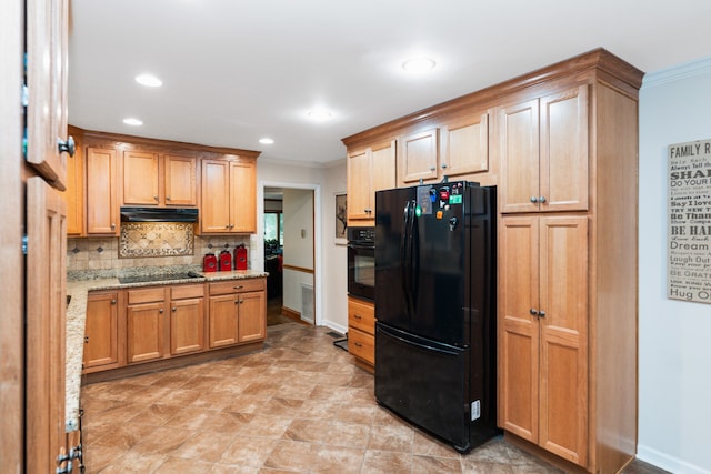 kitchen with black appliances, tasteful backsplash, crown molding, light stone countertops, and light tile patterned floors