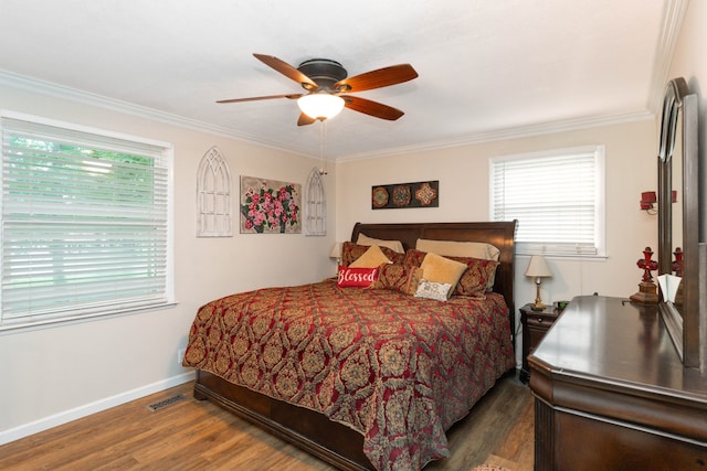 bedroom featuring crown molding, hardwood / wood-style floors, and ceiling fan