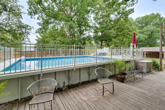 view of pool with a wooden deck