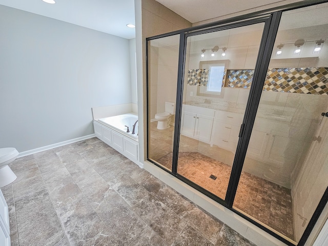 full bathroom with vanity, toilet, and separate shower and tub