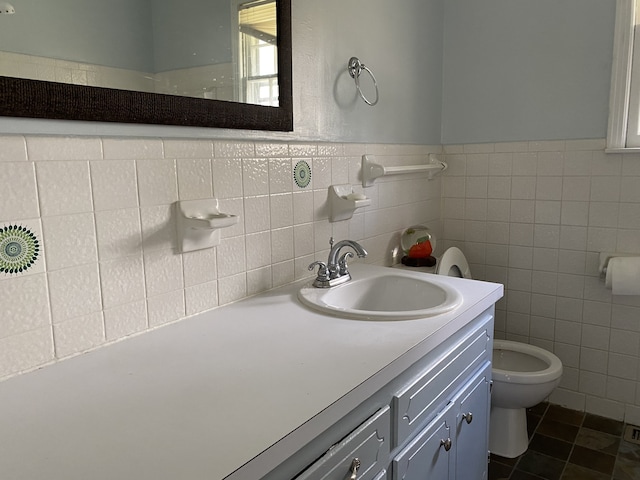 bathroom featuring toilet, vanity, tile walls, tile patterned floors, and decorative backsplash