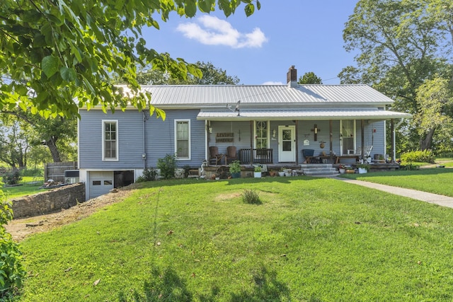 view of front facade with a porch, a garage, and a front yard