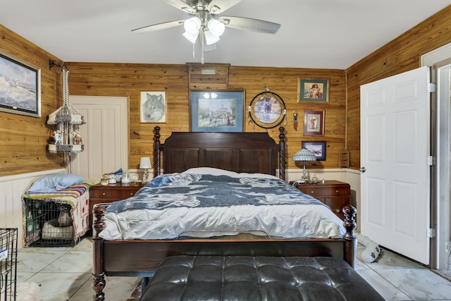 tiled bedroom featuring wood walls and ceiling fan