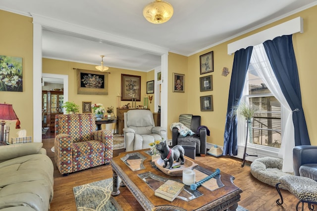 living room with crown molding and hardwood / wood-style flooring