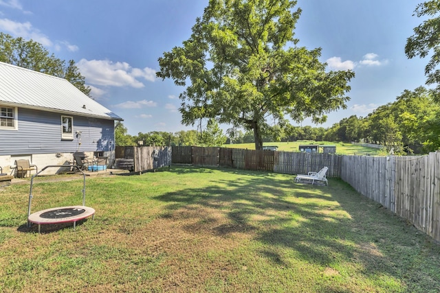 view of yard featuring an outdoor fire pit