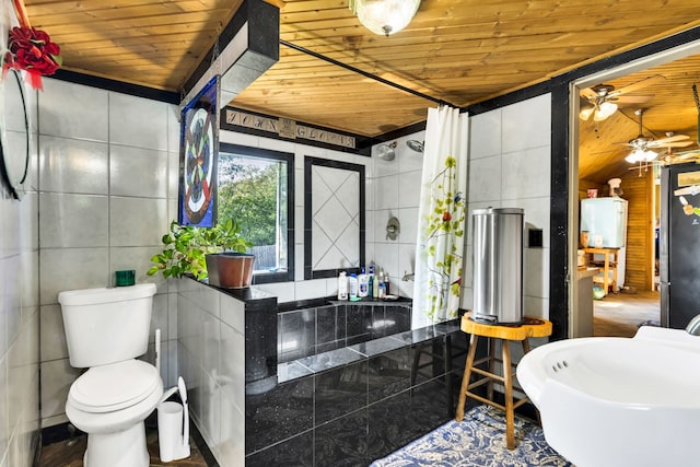 bathroom with hardwood / wood-style floors, tile walls, toilet, wooden ceiling, and ceiling fan