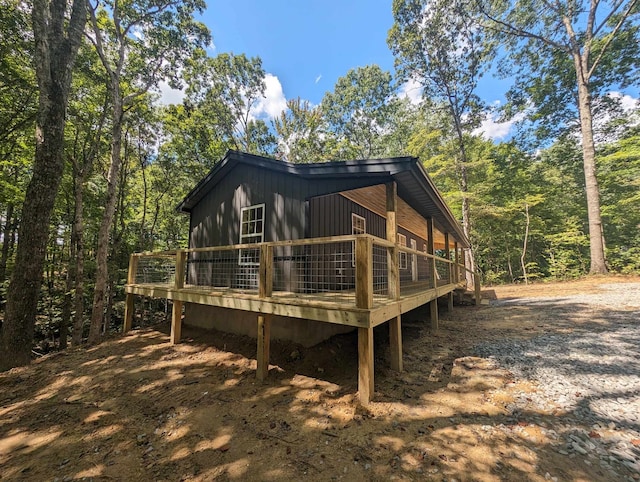 back of property featuring a wooden deck