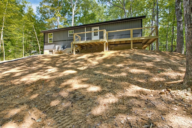 view of front facade with a wooden deck