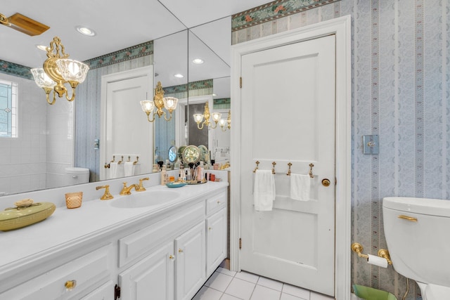 bathroom featuring vanity, a chandelier, toilet, and tile patterned flooring