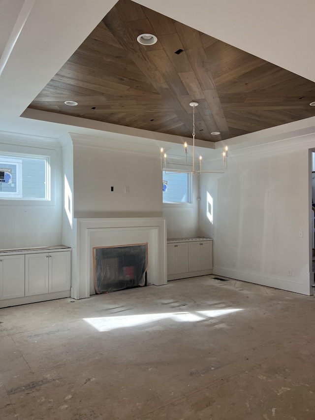 unfurnished living room featuring a raised ceiling, wood ceiling, and a notable chandelier