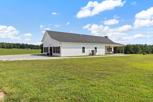 back of house with a yard