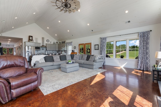 living room featuring high vaulted ceiling