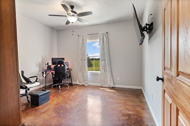 office area with ceiling fan and concrete floors