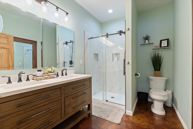 bathroom featuring toilet, dual bowl vanity, and a shower with shower door