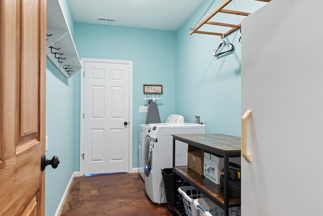 laundry area with washing machine and dryer