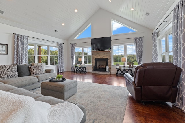 living room with high vaulted ceiling, dark hardwood / wood-style flooring, a healthy amount of sunlight, and a stone fireplace