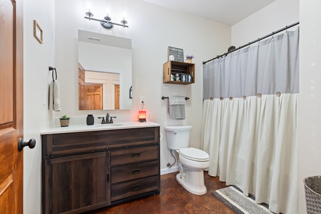 bathroom featuring vanity, toilet, and tile patterned flooring