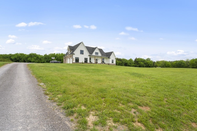 new england style home featuring a front yard