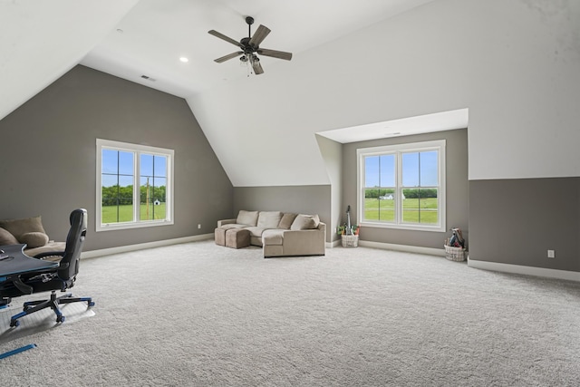 carpeted office space featuring plenty of natural light, ceiling fan, and vaulted ceiling