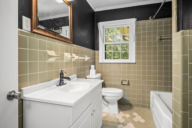 bathroom featuring vanity, ornamental molding, toilet, and tile walls