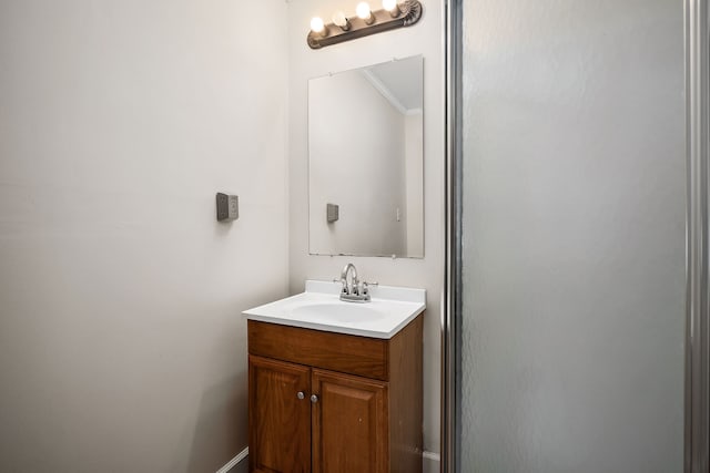 bathroom featuring vanity and crown molding