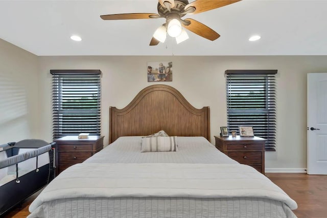 bedroom with hardwood / wood-style flooring and ceiling fan