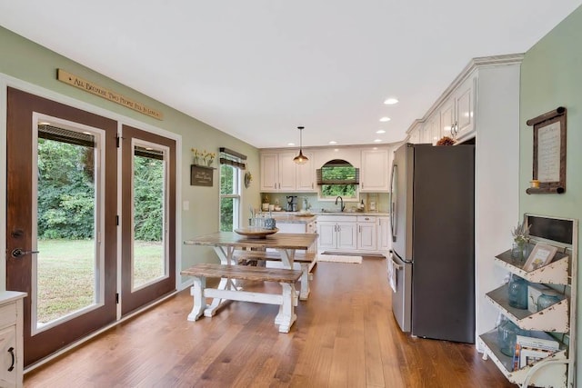 dining area featuring dark wood-type flooring