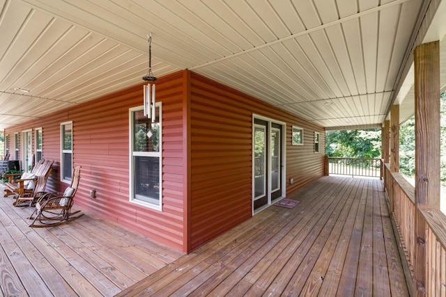 wooden terrace featuring a porch