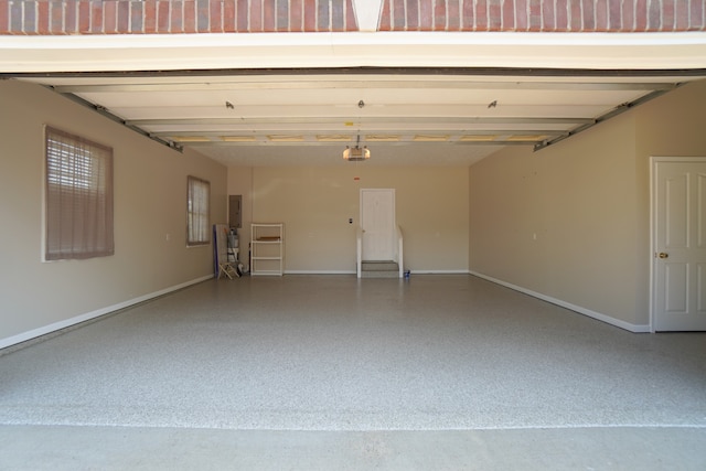 garage featuring a garage door opener and electric panel